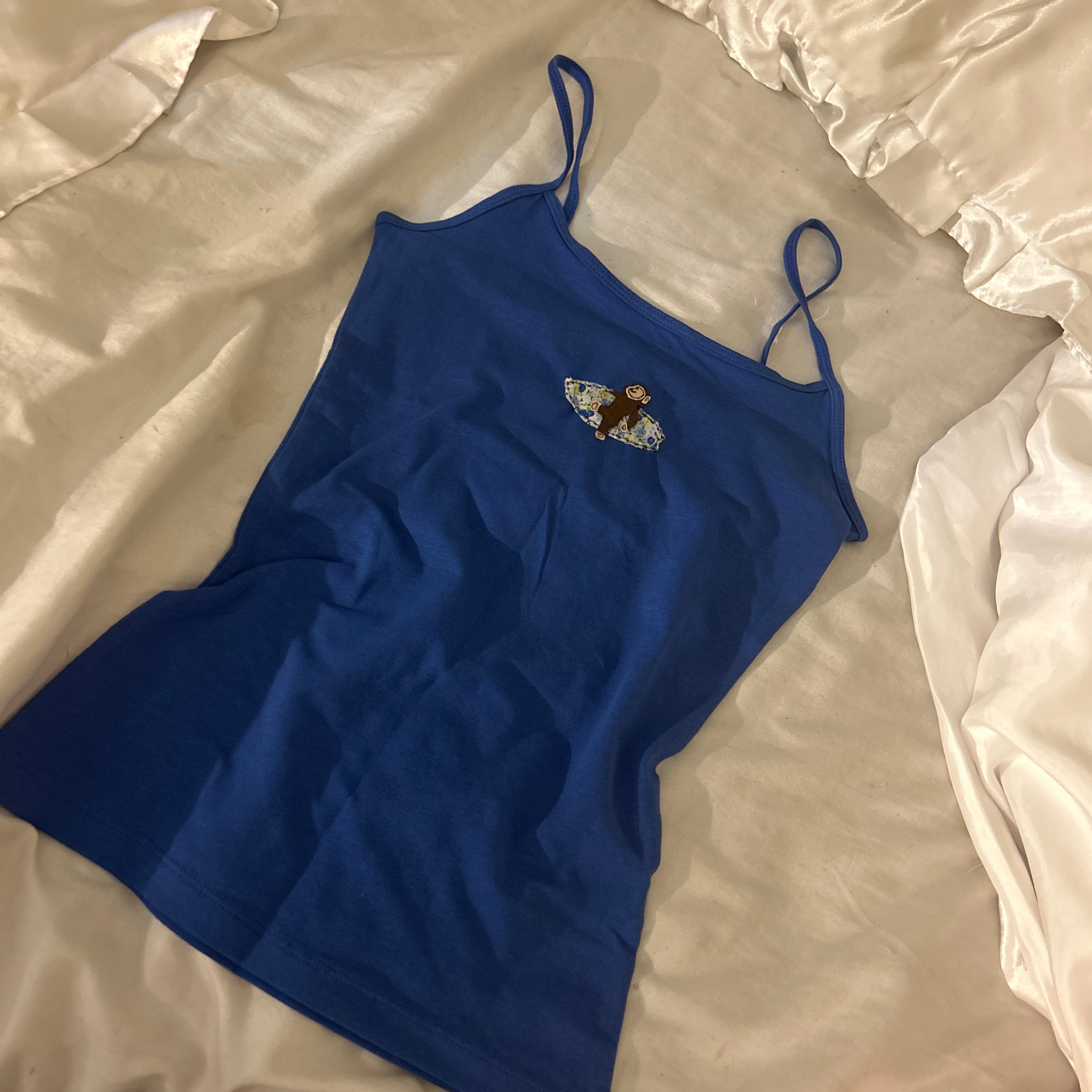 Blue tank with Curious George surf patch